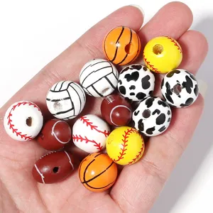 Close-up detail of assorted sports wooden beads, featuring baseball and basketball patterns.