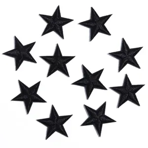 Closeup view showing multiple black star embroidered patches with fine stitching details.