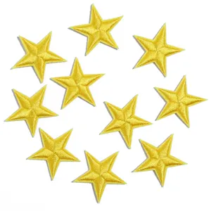 Detailed shot of yellow embroidered star iron-on patches, perfect for clothing DIY decoration.