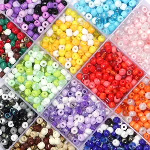 Colorful glass seed beads in storage box for DIY bracelet making and slime filler supplies.