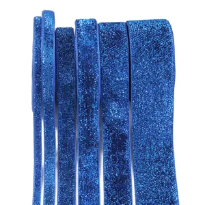 Blue glitter elastic ribbon detail shot, sparkling metallic velvet trim for DIY crafts and gift wrapping.