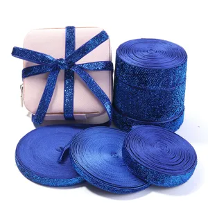 Blue glitter elastic ribbon rolls for DIY sewing crafts, garment accessories, and gift wrapping.