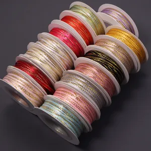 Colorful polyester gold edge ribbon spools, perfect for gift wrapping and DIY crafts.