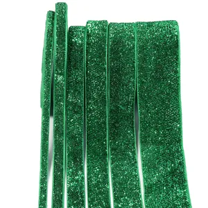 Green glitter velvet ribbon detail shot, shiny craft trim for DIY gifts and clothing accessories