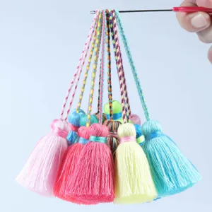 Colorful handmade decorative tassels with braided hanging loops for curtains and apparel crafts.