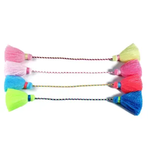 Detailed view of colorful bohemian double-head tassel pendants for curtain and apparel decor.