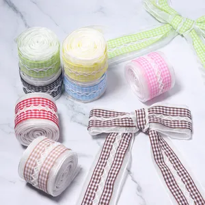 Close-up details of colorful plaid lace ribbons and bows for DIY handmade crafts and decor.