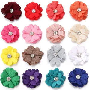 Colorful fabric flower appliques with rhinestone centers for DIY hair accessories crafts.