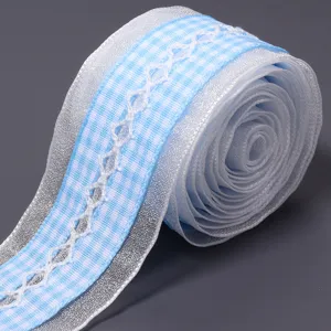 Detailed view of blue and white checkered lace ribbon for gift wrapping and DIY hair bows.