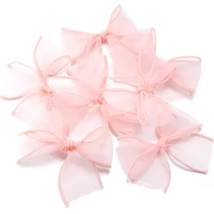 Noeuds en organza rose accessoires de cheveux DIY ruban artisanal pour vêtements et chapeaux.