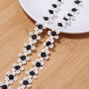 White and black daisy embroidery lace trim polyester DIY sewing craft accessory.