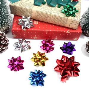 Close-up detail of colorful metallic star ribbon bows arranged for gift wrapping and party decor.