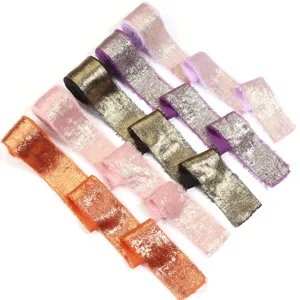 Details of shimmering metallic frayed edge velvet ribbon for wedding bouquets, bows, and gift wrapping.