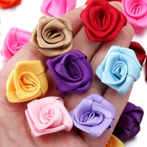 Handmade satin ribbon rose flowers detail view for garments, hair clips, and craft accessories.