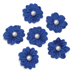 Detail shot of blue fabric flower patches with faux pearls, craft DIY clothing and accessories.