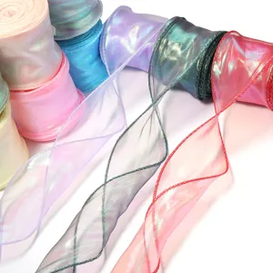 Detailed view of shimmering iridescent organza ribbon with wave edge for gift wrapping and floral decor.