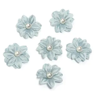 Close-up detail of light blue polyester double layer fabric flowers with faux pearl centers.