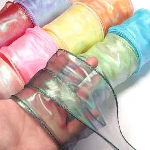 Detailed view of iridescent organza ribbon showcasing shimmering texture and translucent quality.