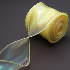 Detailed view of a shimmering yellow organza ribbon roll for gift wrapping and party decor.