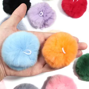 Colorful fluffy fur pom poms with elastic loops for DIY keychains, bags, hats, and clothing accessories.