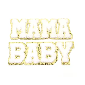White chenille MAMA and BABY letter patches with gold glitter border for apparel decor.