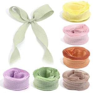 Colorful polyester ruffle bubble crepe ribbon rolls and bows for gift wrapping and DIY crafts.