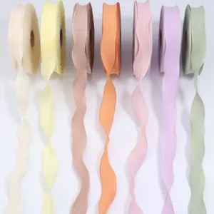 Polyester lotus leaf edge bubble crepe ribbon for gift box packaging and hair bow accessories.