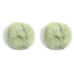 Close-up of light green fluffy fur ball detail with white elastic hanging loop for accessories.