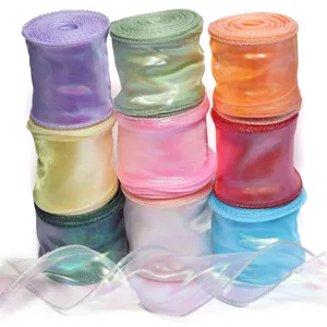 Close up detail of colorful iridescent organza ribbon rolls for wrapping and decor.