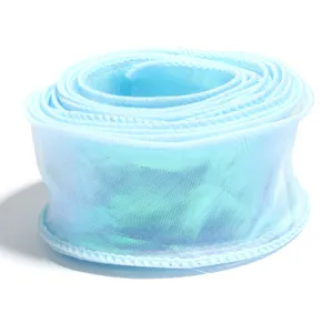 Close up of light blue iridescent organza ribbon roll, showing shiny texture and wired edge.