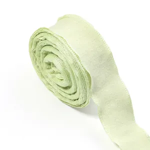 Close-up of a light green bubble wrinkle ribbon, showing delicate texture and fine details.
