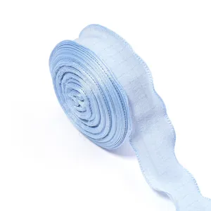 Light blue ruffled chiffon ribbon roll for gift wrapping hair bow DIY sewing crafts detail.