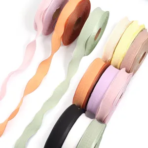 Polyester lotus leaf edge bubble wrinkled ribbon for gift packaging and hair bow accessories.