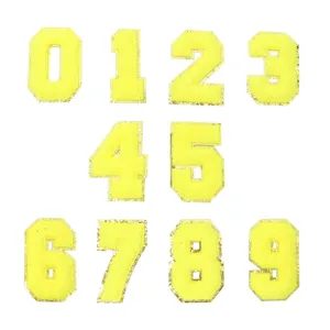Toppe ricamate con numeri in ciniglia gialla e bordo glitterato dorato per accessori fai da te.
