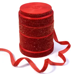 Red velvet ribbon with gold glitter sparkling texture, perfect for Christmas gift wrapping.