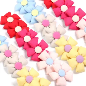 Detailed view of colorful plush fabric five-petal flowers, perfect for DIY hair clips and bag accessories.