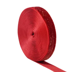 Red velvet ribbon detail shot, gold glitter edge for gift wrapping, holiday crafts and bows.