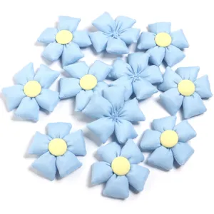 Detailed close-up shot of cute light blue stuffed fabric flower DIY accessories.