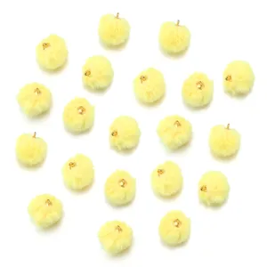 Yellow faux fur pom pom charms with gold loops for DIY jewelry keychains crafts accessories