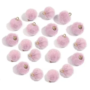 Light purple faux fur pom pom charms with gold loops for keychains, earrings and DIY crafts.