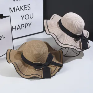 Womens summer straw hat with big wavy brim and black bow fashion sun protection beach cap