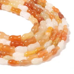 Natürlicher goldseidener Jade roter Aventurin Kürbislose Perlen Detail bunte Edelsteine.