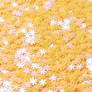 Holeless PVC snowflake sequins for nail art and DIY crafts, yellow iridescent glitter pieces.