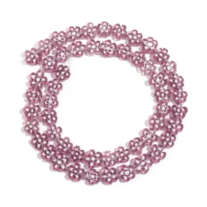 Purple white millefiori glass flower beads detail view for DIY jewelry making accessories.