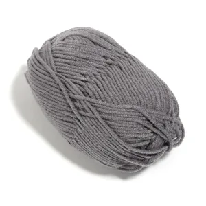 Close-up of soft grey milk cotton yarn ball, ideal for hand knitting crafts and DIY projects.