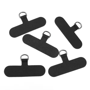 Detailed view of black universal phone lanyard tether tabs featuring sturdy metal D-rings.