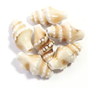 Close-up detail of ceramic conch beads, high temperature glazed DIY jewelry accessories.