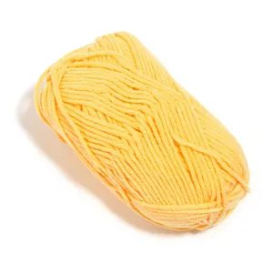 Detailed view of bright yellow 5-ply milk cotton yarn ball, perfect for knitting and DIY.