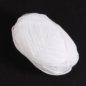 White milk cotton yarn ball detail, soft texture for hand knitting DIY craft projects.