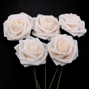 Detailed close-up view of elegant white PE foam artificial roses with green stems for DIY decor.